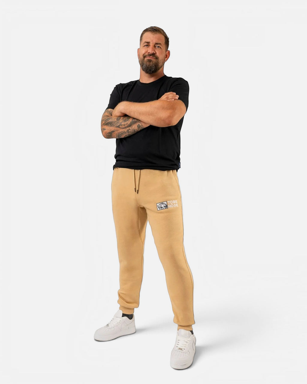 Tobe Hose Studio Herren-Jogginghose in Beige mit Hyänen-Logo-Stickerei, Seitentaschen und weichem Innenfutter