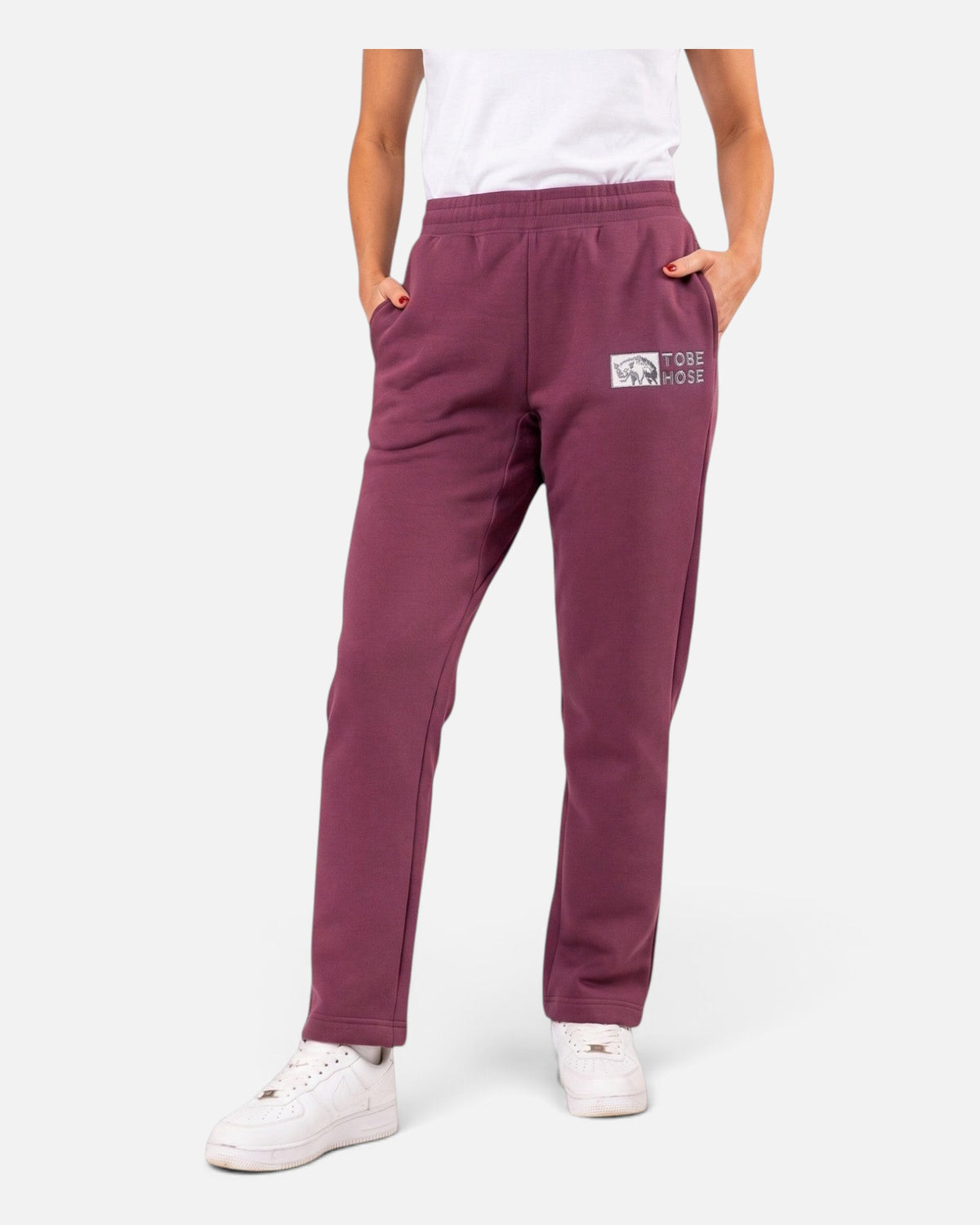 Tobe Hose Studio Damen Jogginghose in Pflaume mit Hyänen-Logo Stickerei, Seitentaschen und bequemem Schnitt