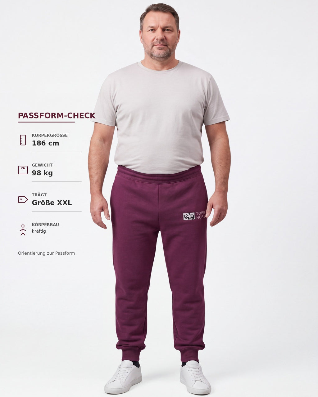Tobe Hose Studio Herrenhose in Pflaume mit elastischem Bund, Reißverschlusstaschen und Hyänen-Logo-Stickerei