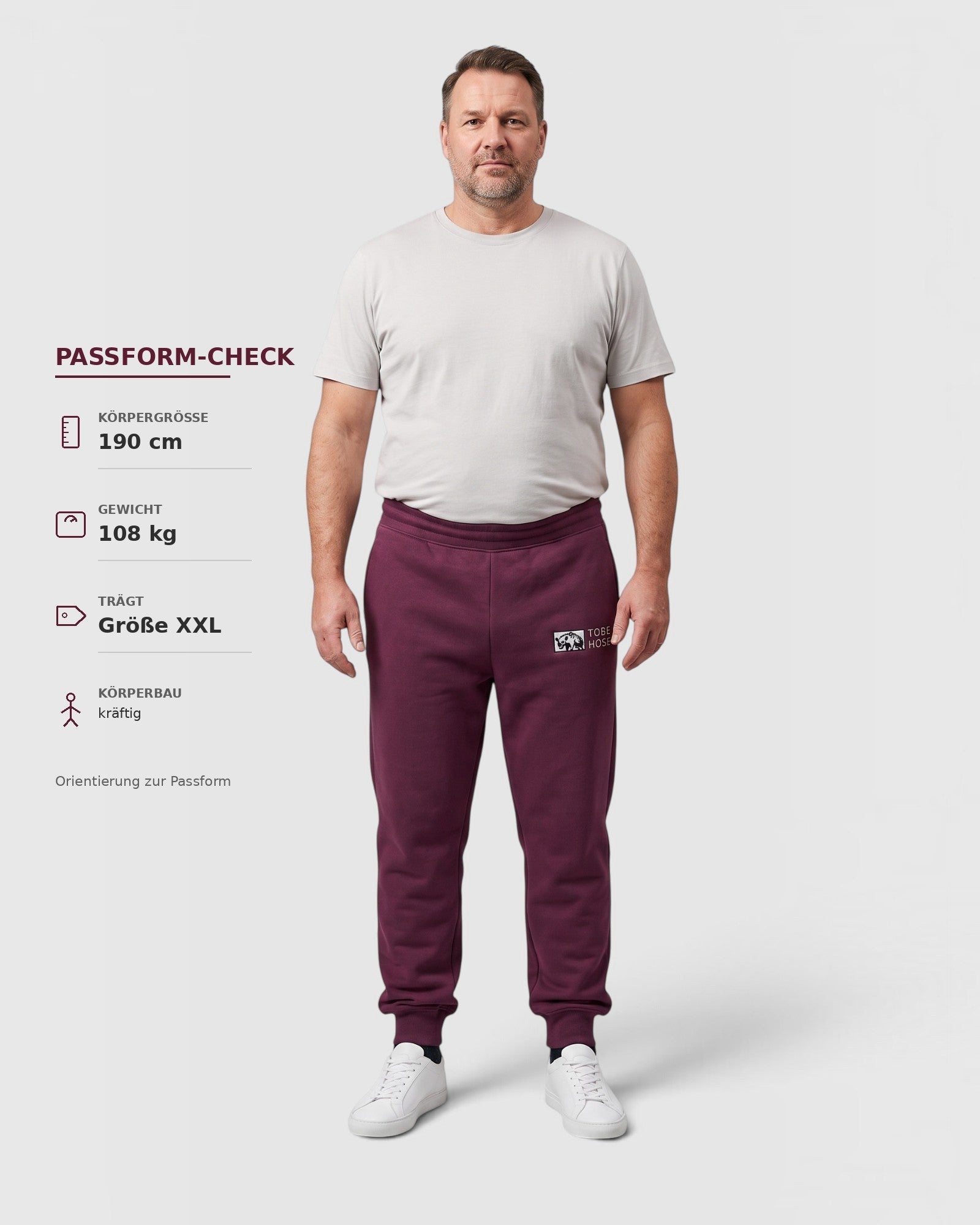 Tobe Hose Studio Herren-Jogginghose in Pflaume mit Hyänen-Logo, elastischem Bund und Reißverschlusstaschen.