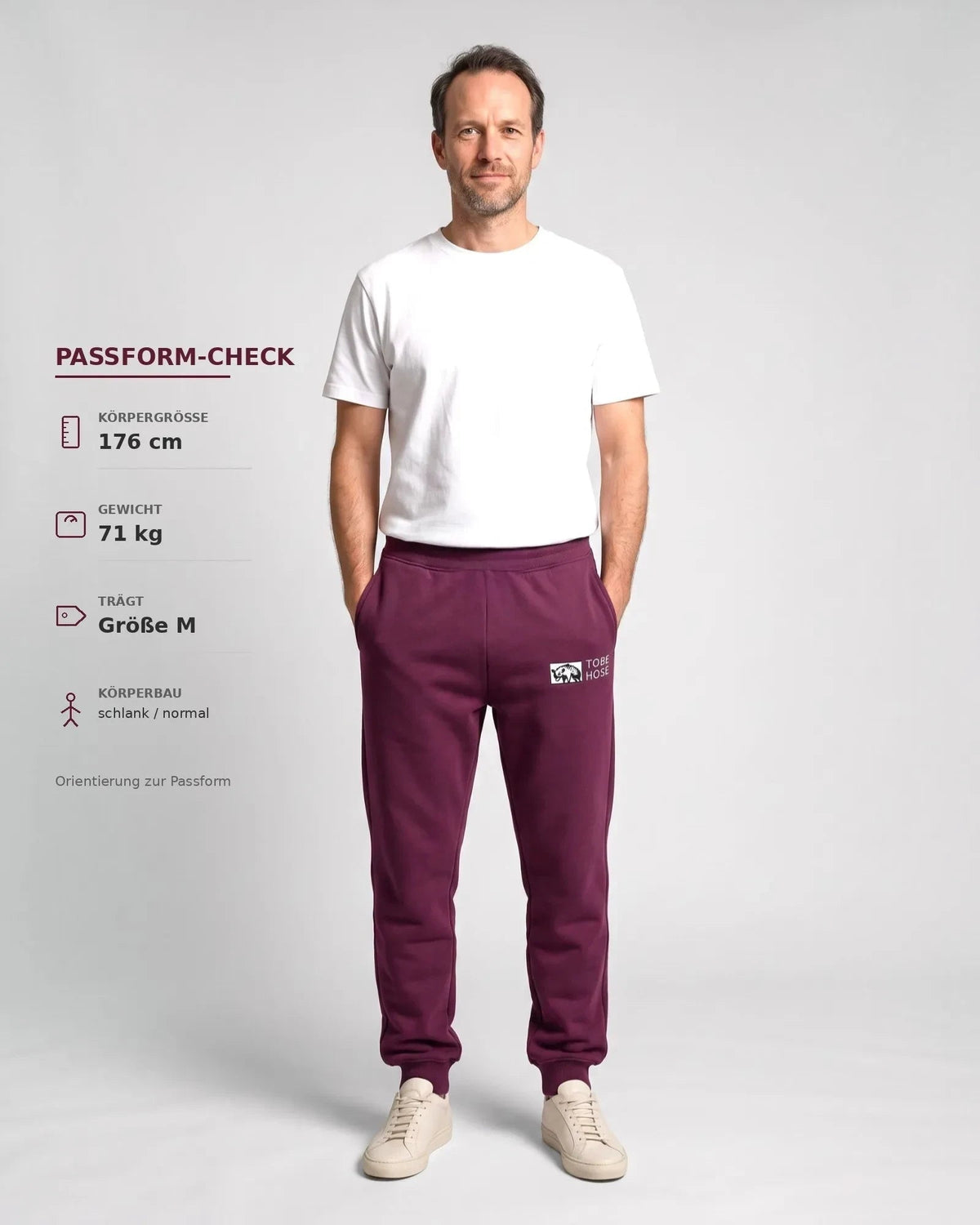 Tobe Hose Studio Herren-Jogginghose in Pflaume mit elastischem Bund, Reißverschlusstaschen und Hyänen-Logo-Stickerei.
