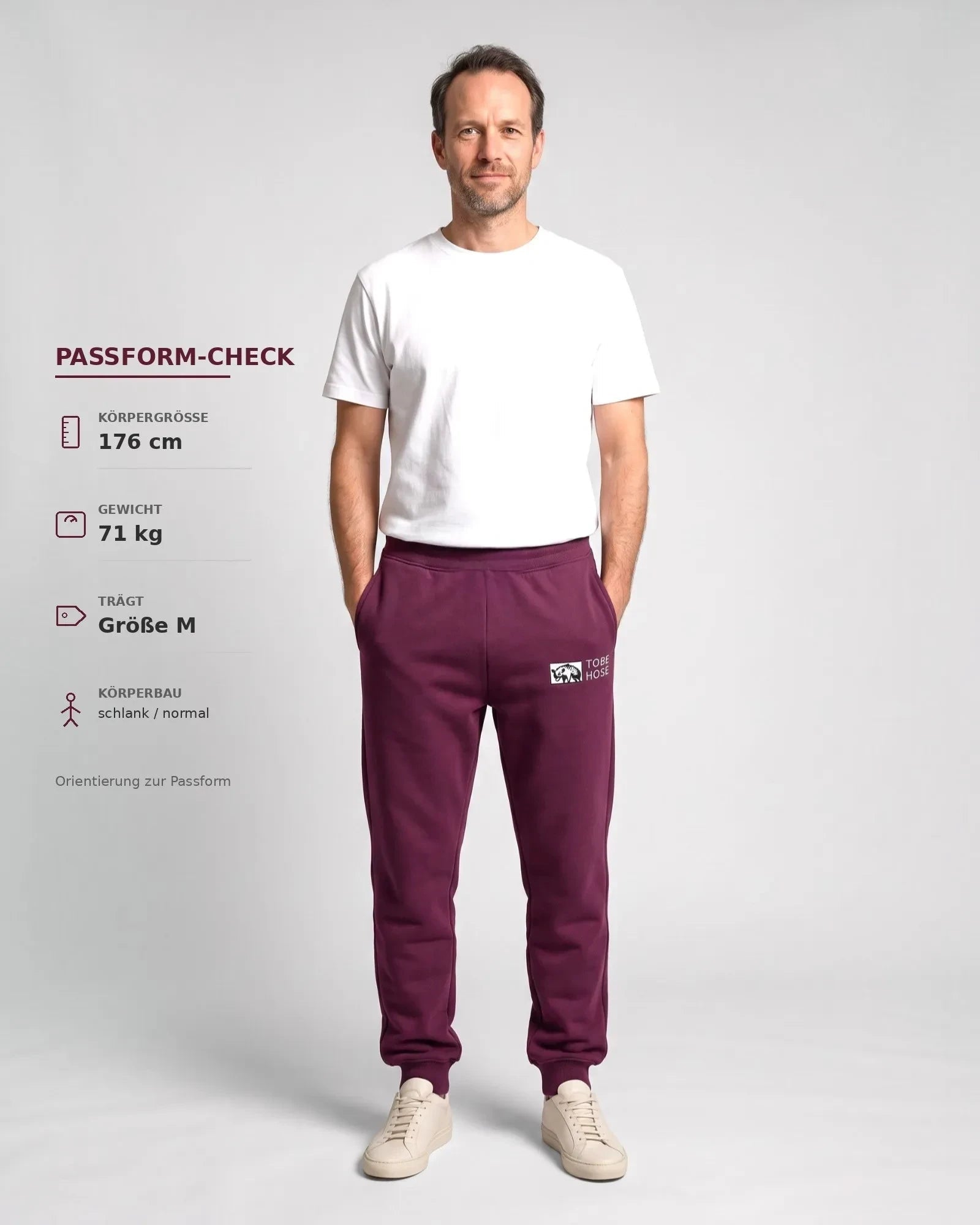 Tobe Hose Studio Herren-Jogginghose in Pflaume mit elastischem Bund, Reißverschlusstaschen und Hyänen-Logo-Stickerei.