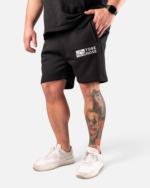 Tobe Hose Studio schwarze Baumwollshorts mit Logo-Stick am Oberschenkel und Reißverschlusstaschen