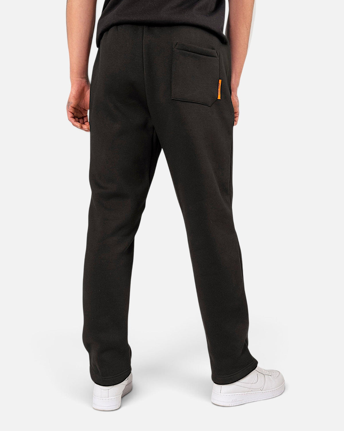 Tobe Hose Studio Herren-Jogginghose in Schwarz mit Gesäßtasche und orangefarbenem Logo-Detail, Rückansicht