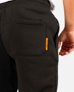 Tobe Hose Studio Herren-Jogginghose in Schwarz mit Gesäßtasche und orangefarbenem Marken-Label