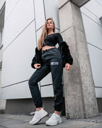 Tobe Hose Studio Damen-Hose Luft in Schwarz aus robustem Nylon mit gesticktem Hyänen-Logo und Reißverschlusstaschen